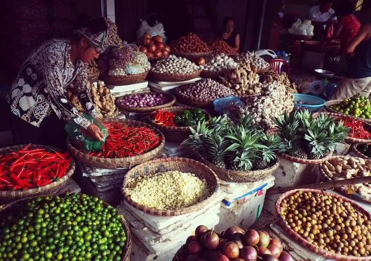 Peppers and other ingredients in baskets at a market in Hanoi - Hanoi in a day