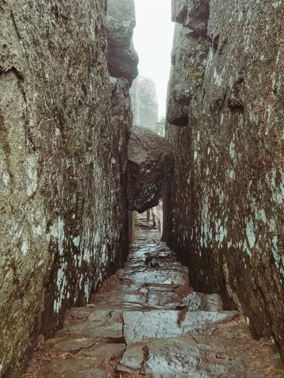 Rock stairs with a boulder overhead during the Old Rag Hike