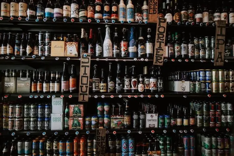 beer bottles displayed on a wall