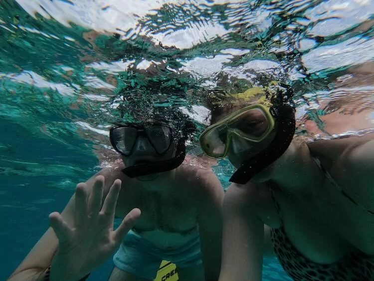 Snorkeling in Belize - Kat and Chris with their snorkels on looking at the camera