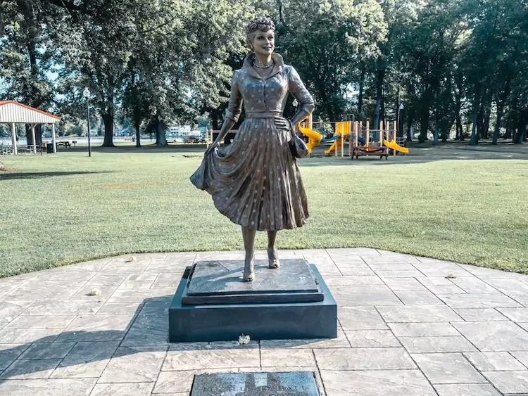 brown Lucille Ball state in a polka dot dress