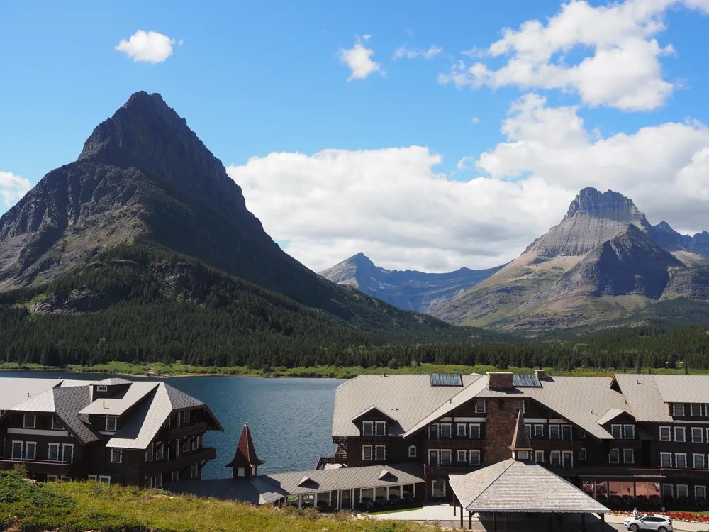 Many Glacier Hotel with Swiftcurrent Lake and the mountains in the background