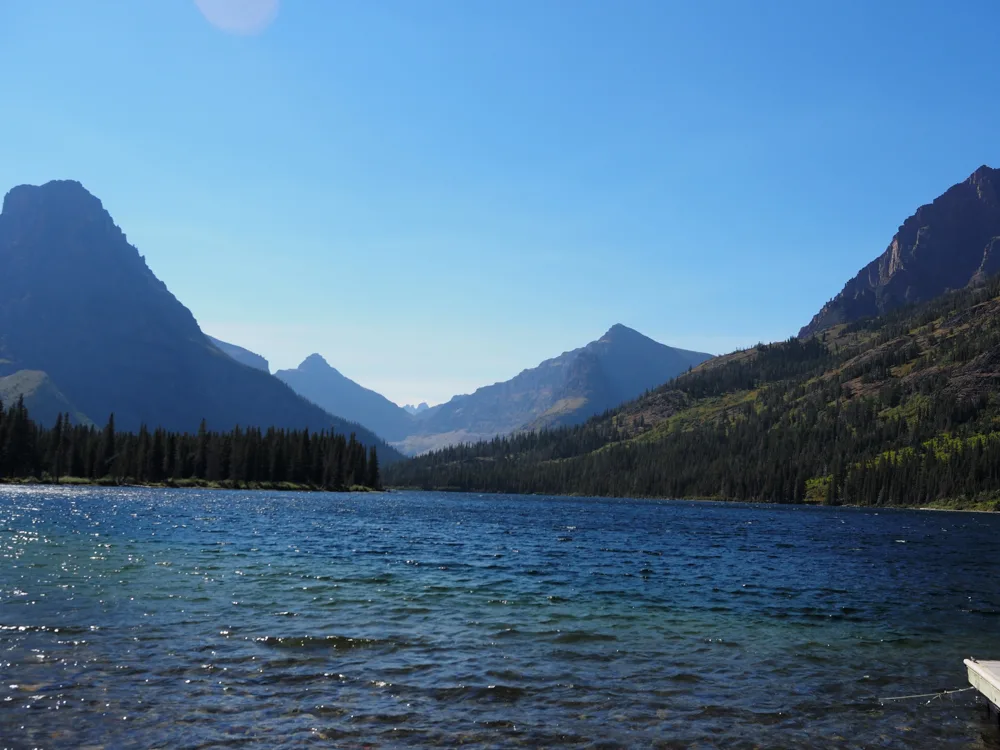 Two Medicine Lake in the afternoon with mountains in the background | Itinerary for Glacier National Park