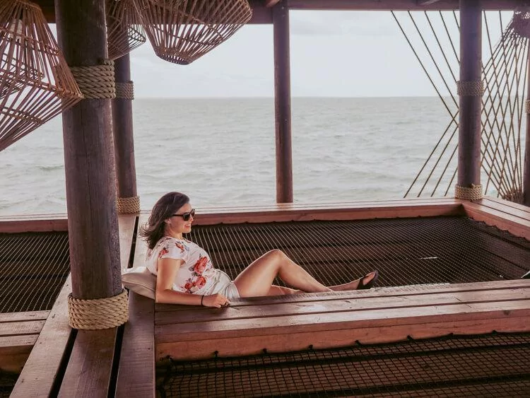 Kat relaxing at the Big Dock Bar over the water