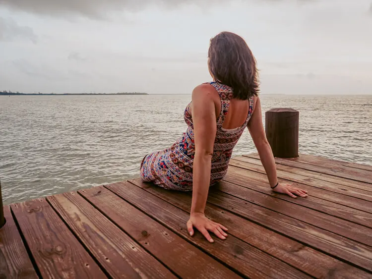 Kat sitting on the dock at Hopkins Bay Resort