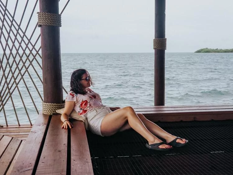 Kat sitting over the netting at the Big Dock Bar