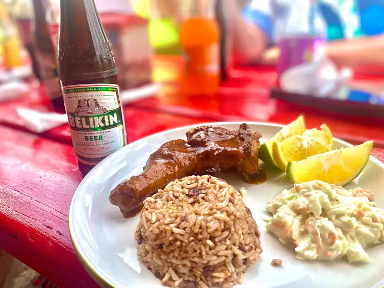 Traditional lunch of rice and beans with a Belikin