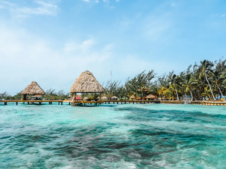 Ultimate Belize Honeymoon - Clear Caribbean water and docks over the water