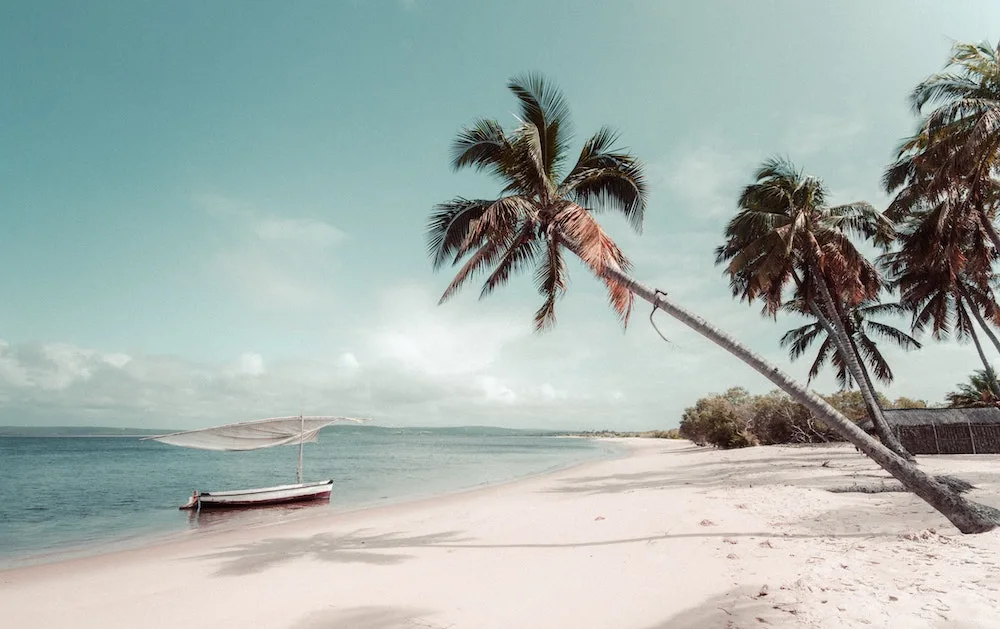 Beautiful beach with boats in the water in Mozambique