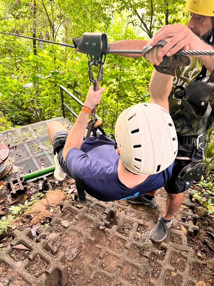 Chris on the platform ready to zipline in Costa Rica