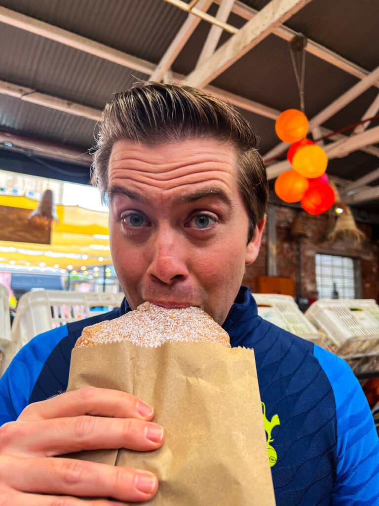 Chris eating dessert at Neighbourgoods Market