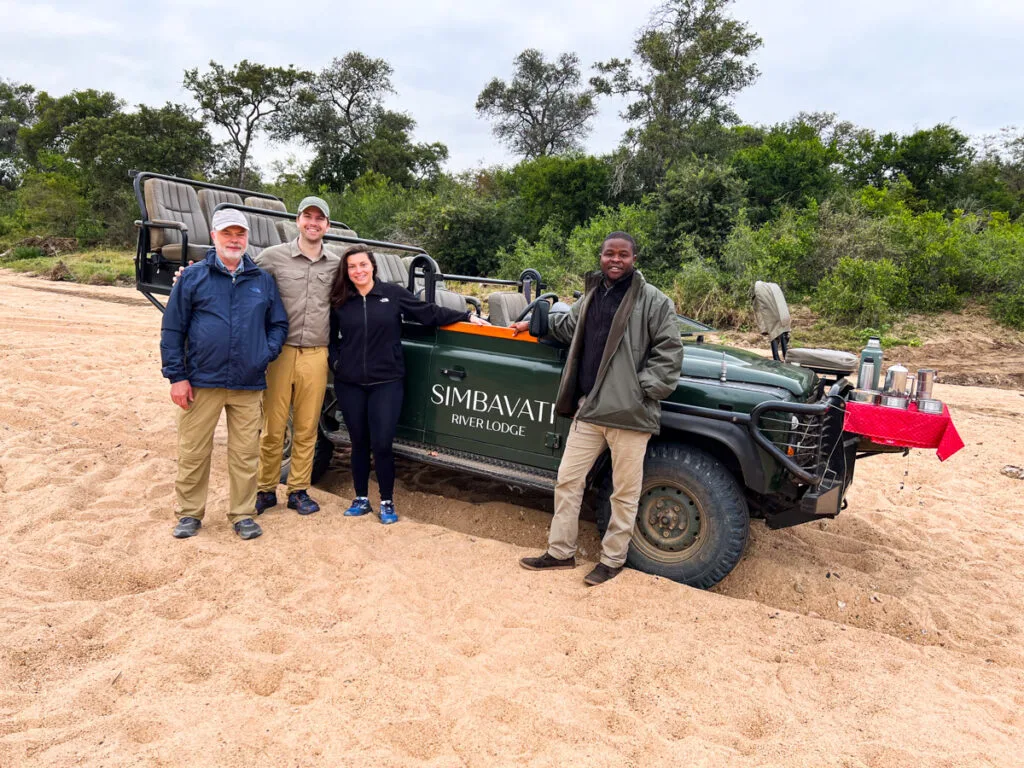 Kat, Chris, and dad with guide on safari