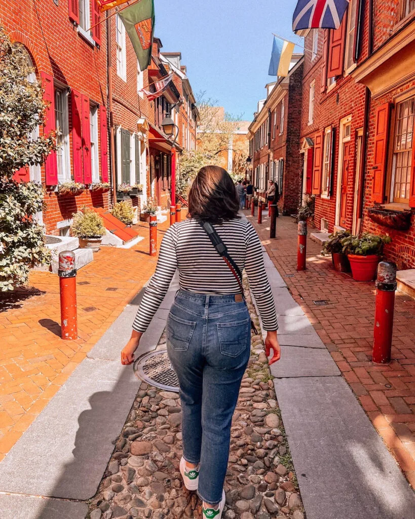 Kat walking down Elfreth's Alley