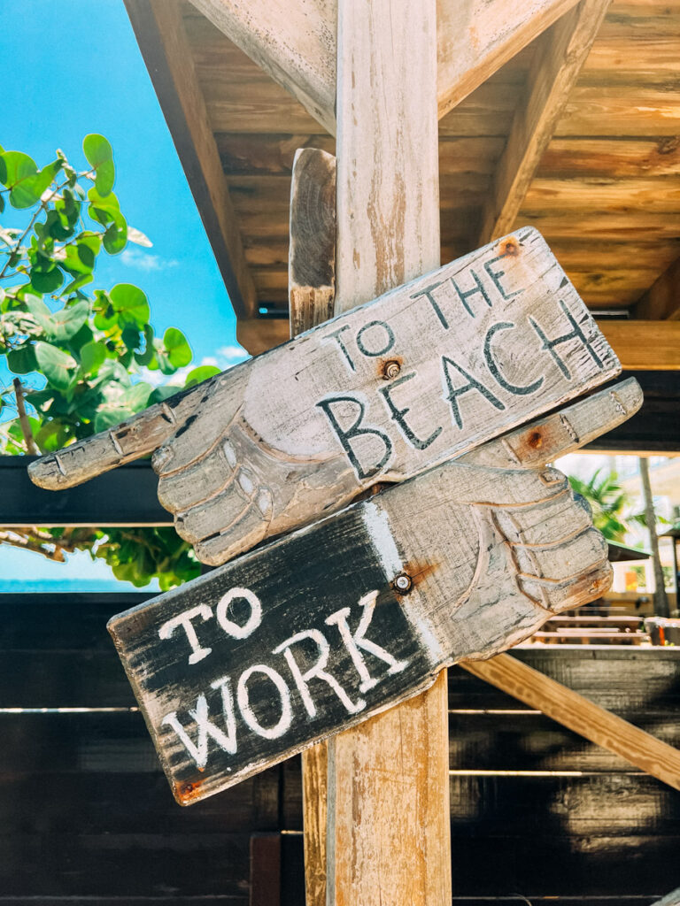 To the Beach and To Work sign