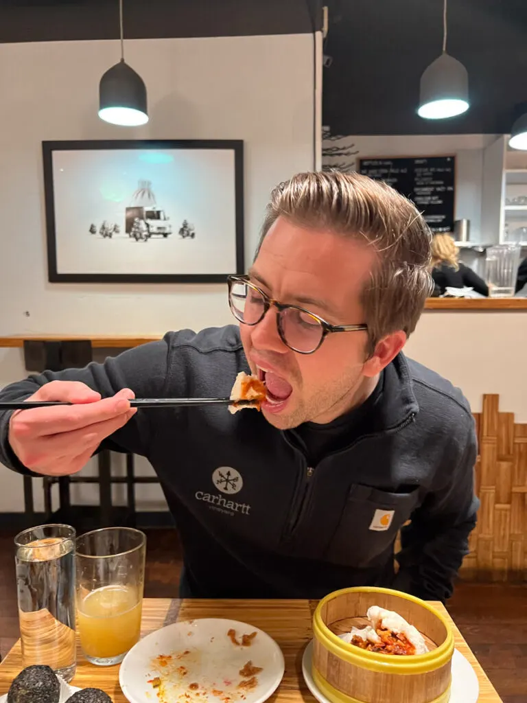 Chris eating Dim Sum at Little Bird