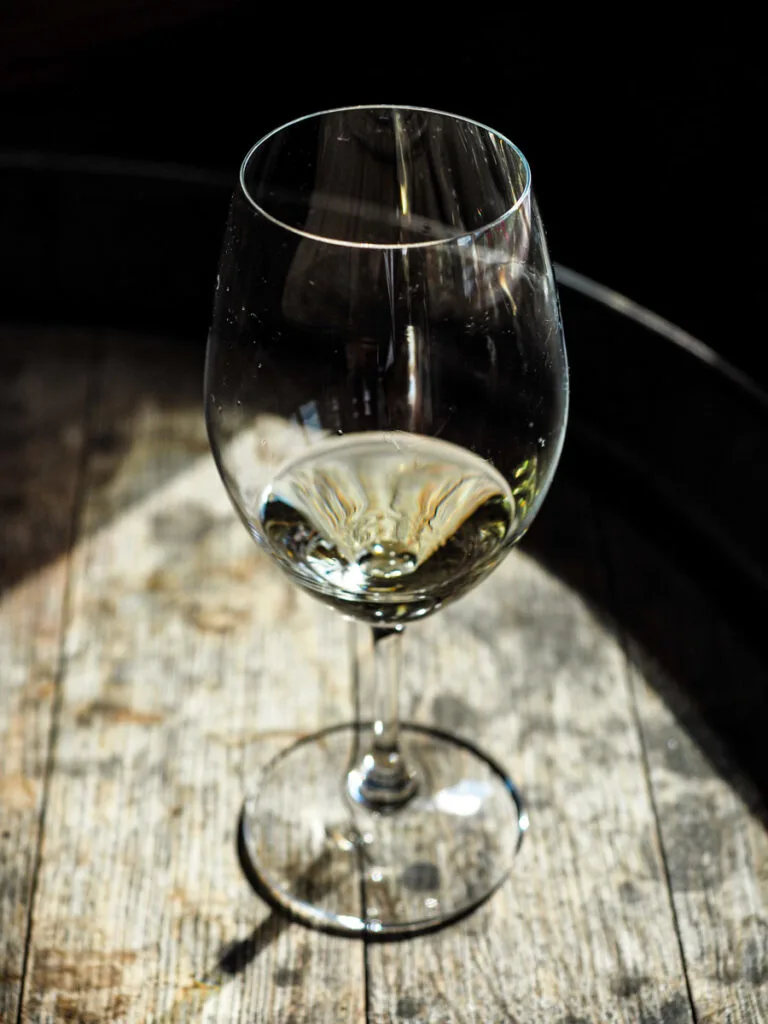 White wine in a glass at Quails Gate Winery