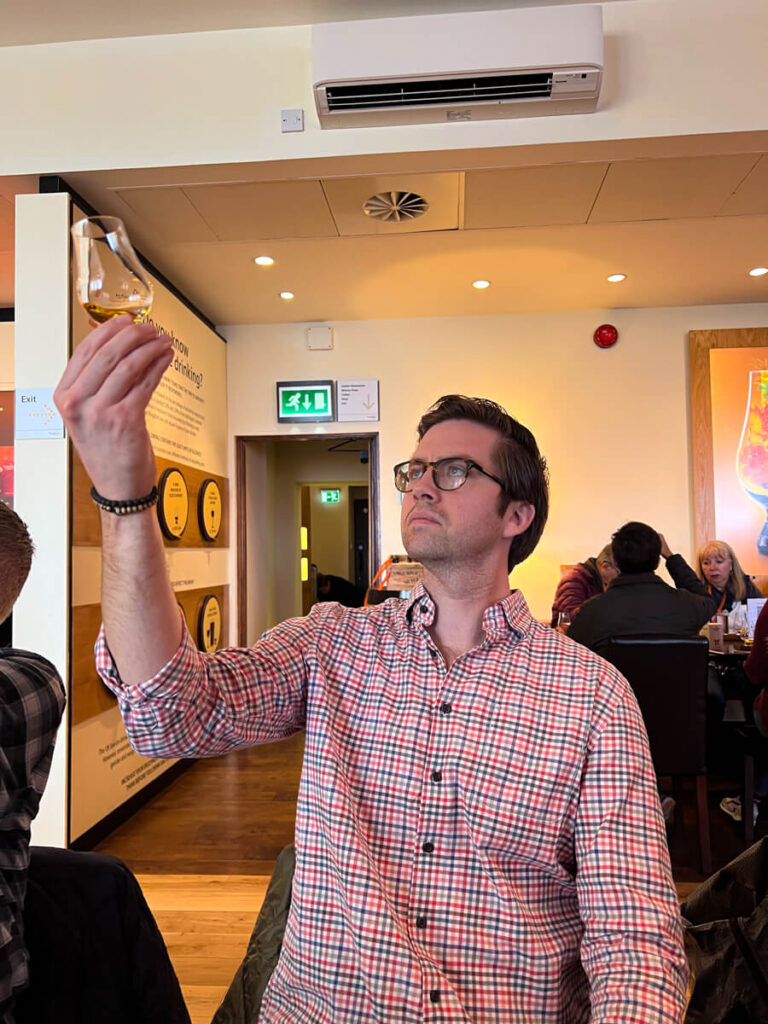 Chris inspecting a dram at the Scotch Whisky Experience