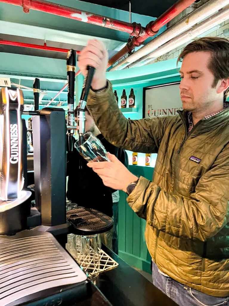 Chris pouring the perfect pint at the Guinness Storehouse