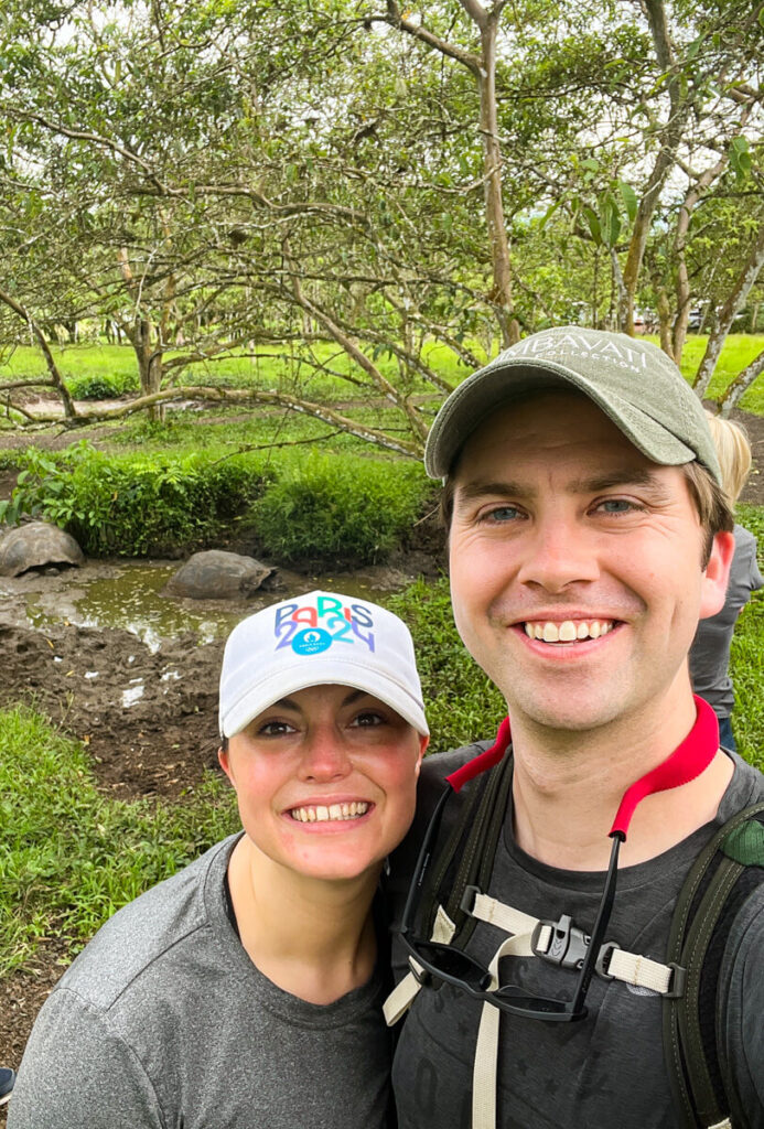 Kat and Chris with Galapagos tortoises in the background