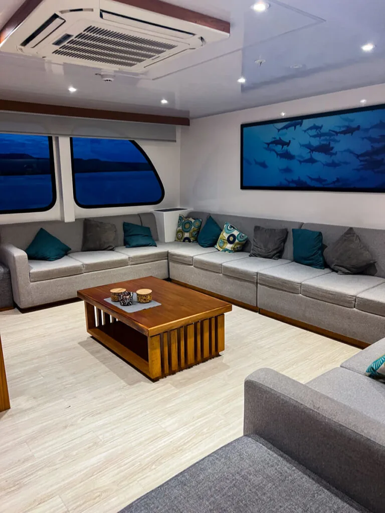 Living room on La Reina Silvia Voyager Galapagos Cruise
