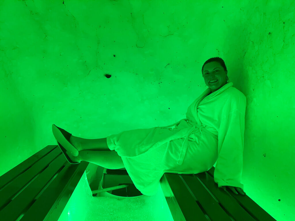 Kat sitting in the snow sauna at Arctic SnowHotel