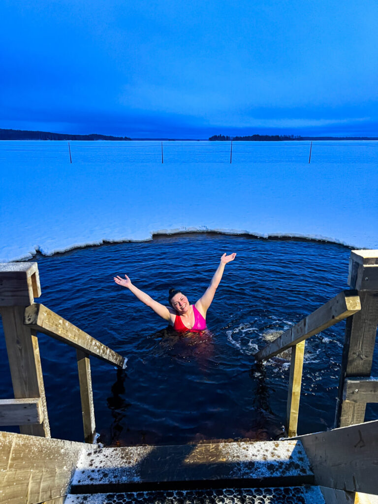 Kat smiling in the freezing lake at Apukka Resort