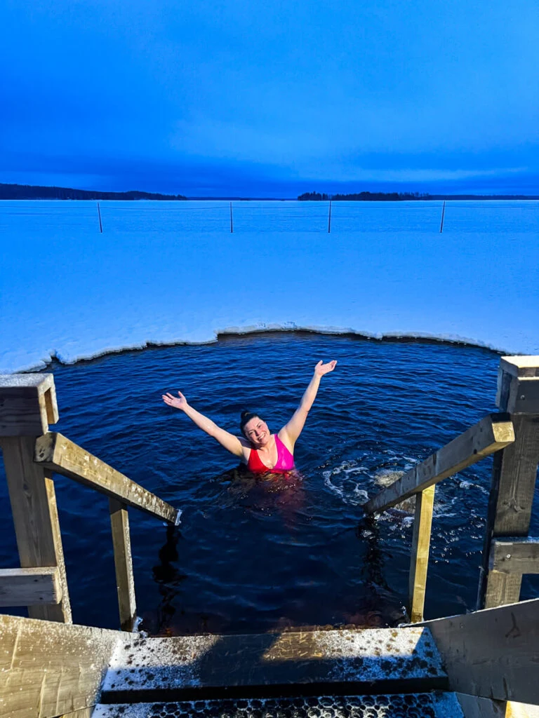 Kat smiling in the freezing lake at Apukka Resort