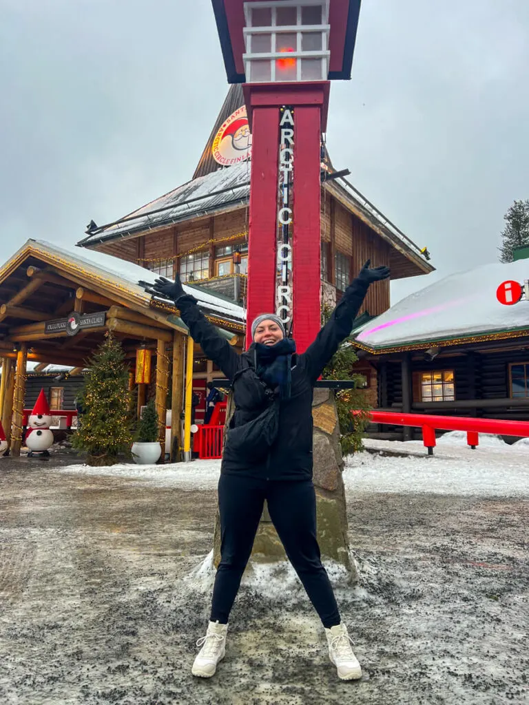 Kat straddling the Arctic Circle line at Santa's Village.