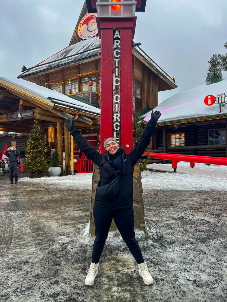Kat straddling the Arctic Circle line at Santa's Village. 3