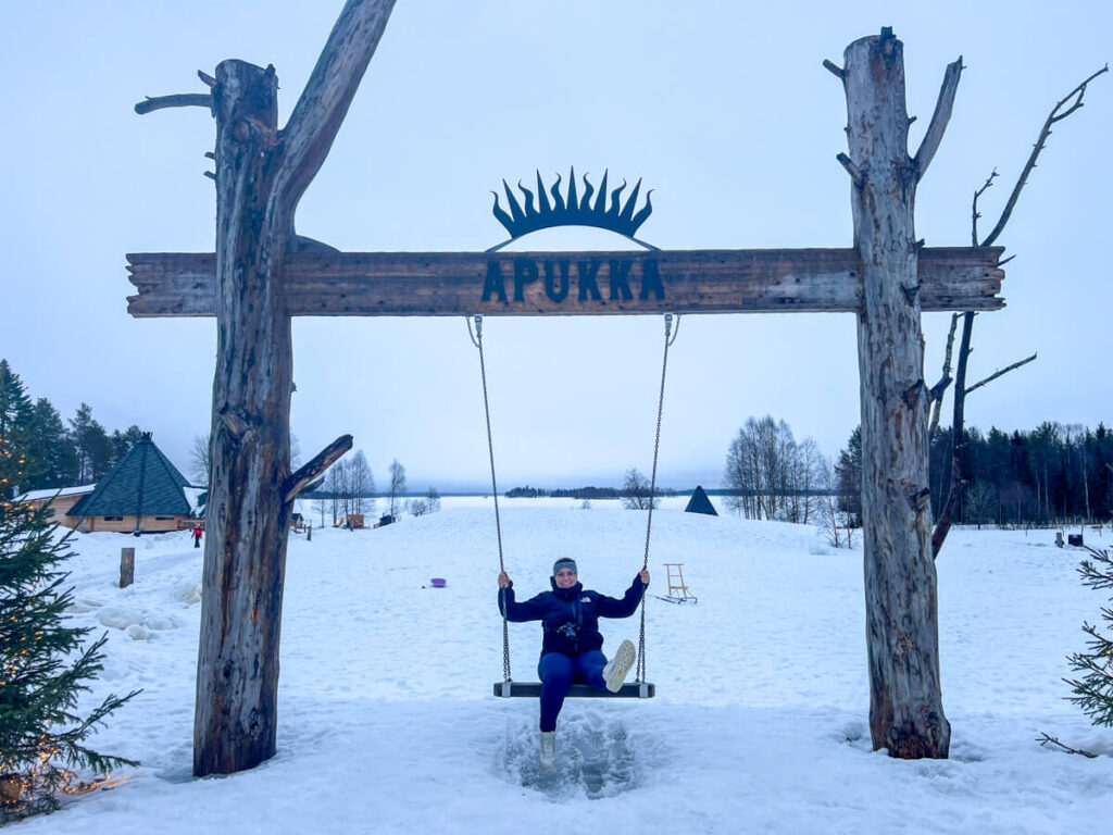 Kat swinging on a swing at Apukka Resort