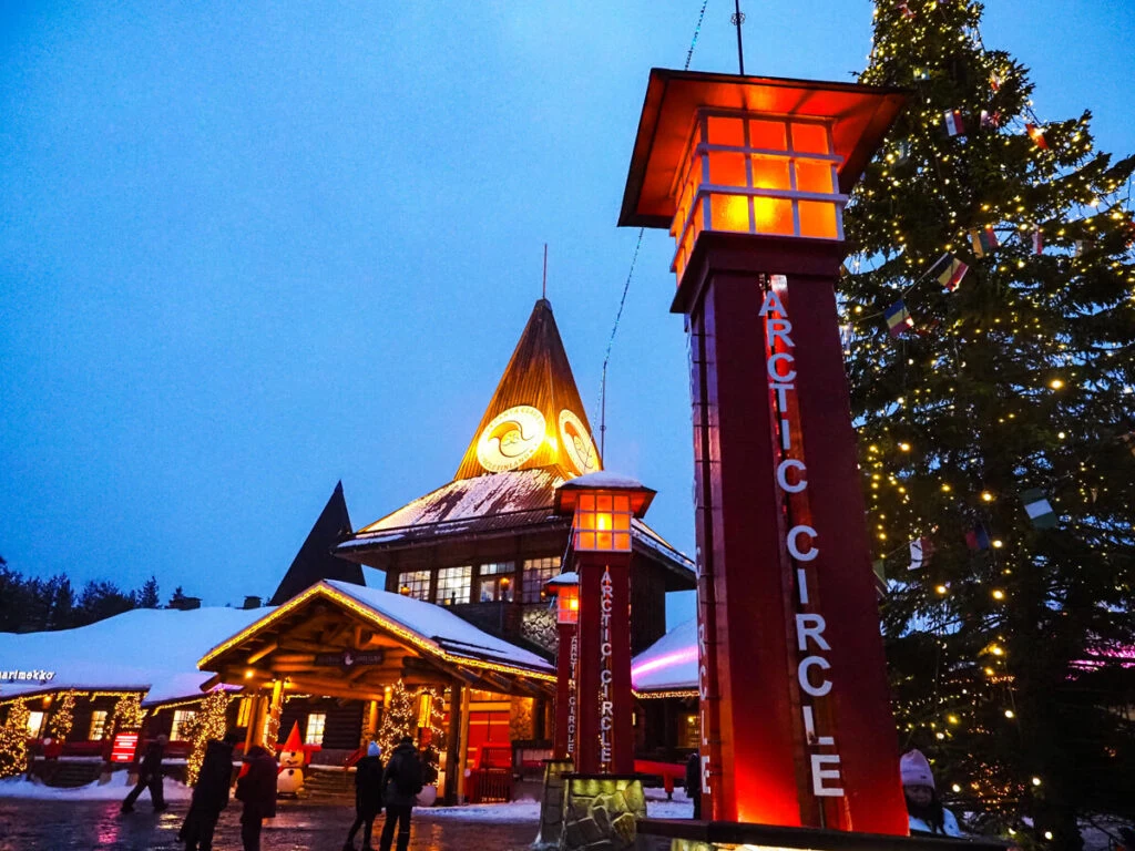Santa's Village at dusk with arctic circle sign