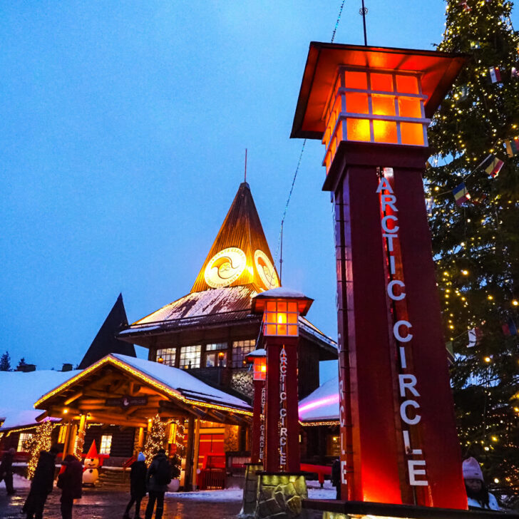 Santa's Village at dusk with arctic circle sign