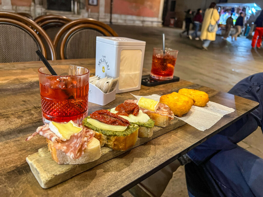 Cicchetti on a plank with negronis