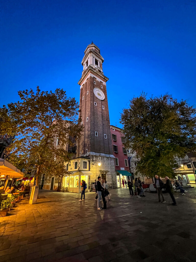 Evening in Venice with a view of a tower in a square