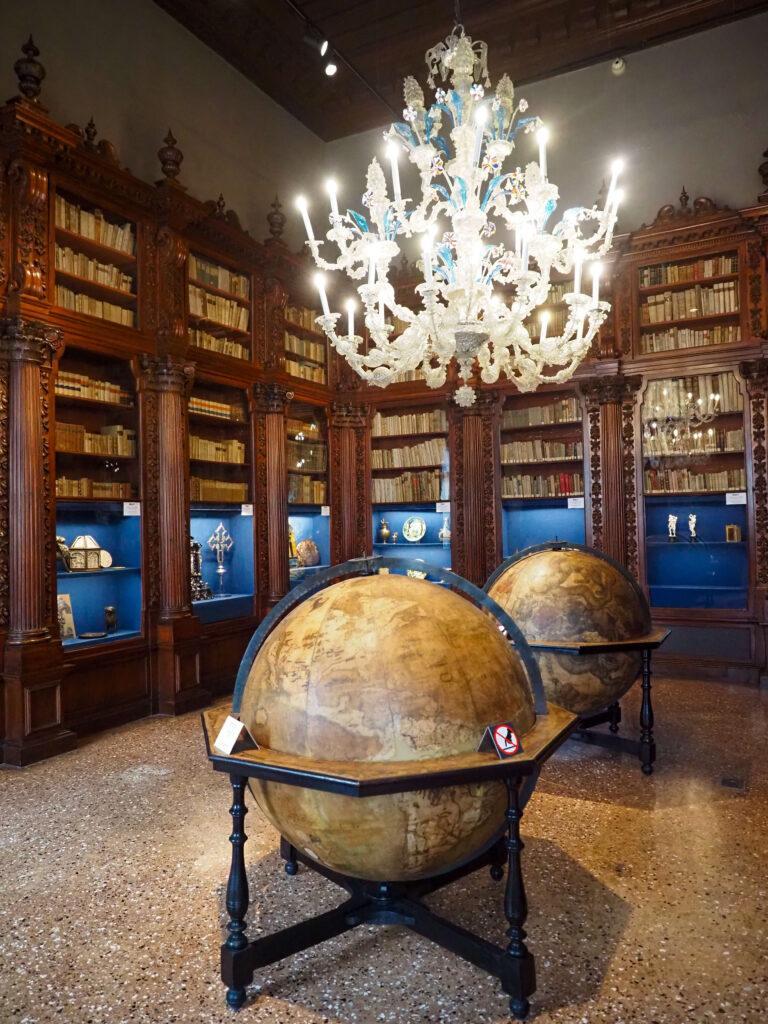 Museo Correr area in Venice room with globes and books