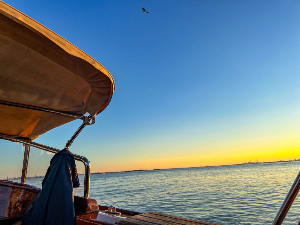 View from water taxi heading to Venice at sunset