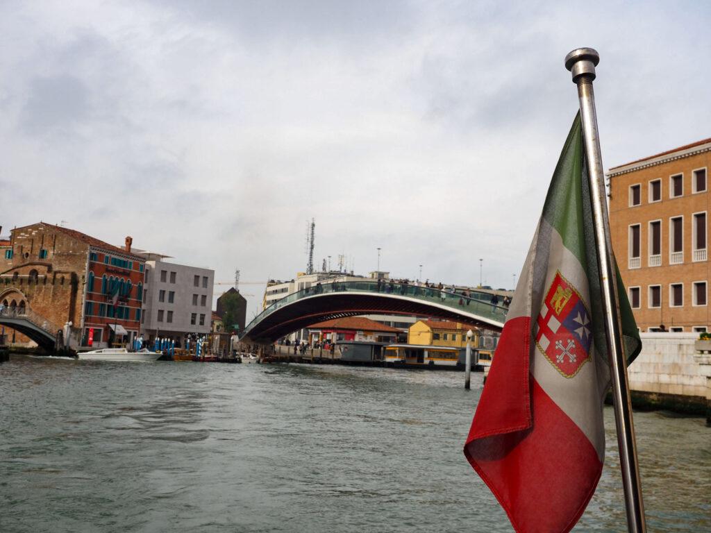 View of the Grand Canal in Venice from a vaporetto with flag on the back
