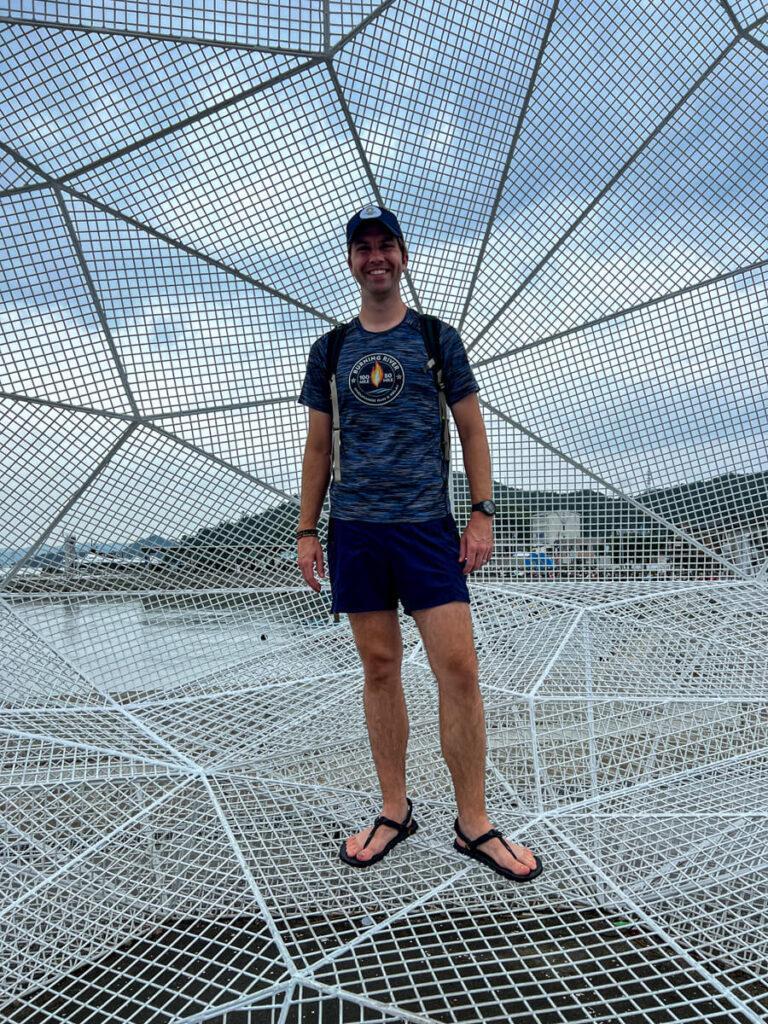 Chris in a cage art piece at Naoshima Art Island