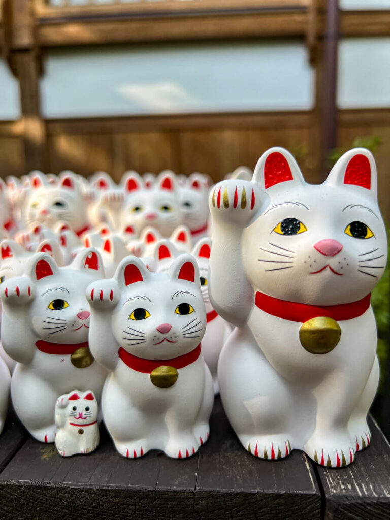 Close up of several beckoning cats at Gotokuji temple